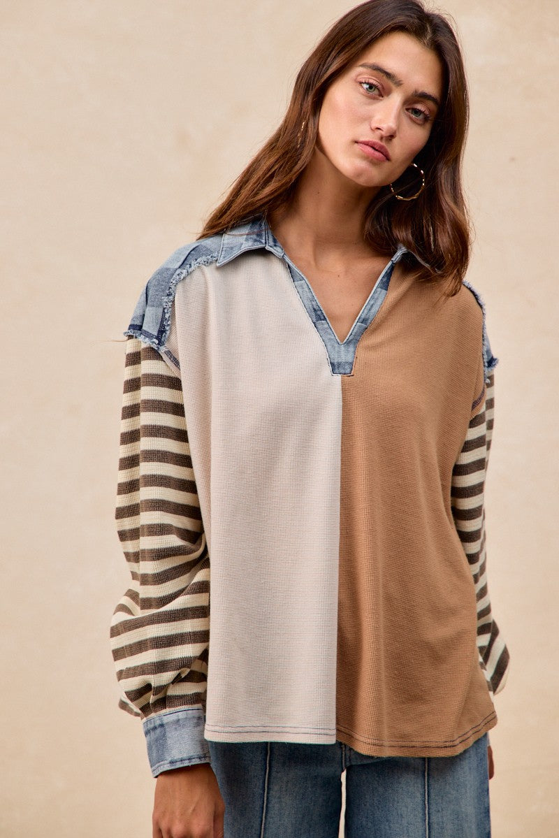 Model wearing Checker Denim Waffle Mix and Match Top in oatmeal and latte with denim collar and striped sleeves, available at TandyWear Boutique in Commack, NY. front view 
