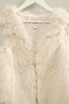 Soft beige faux fur open vest featuring a plush texture and relaxed fit, perfect for layering in Long Island boutique fashion.
