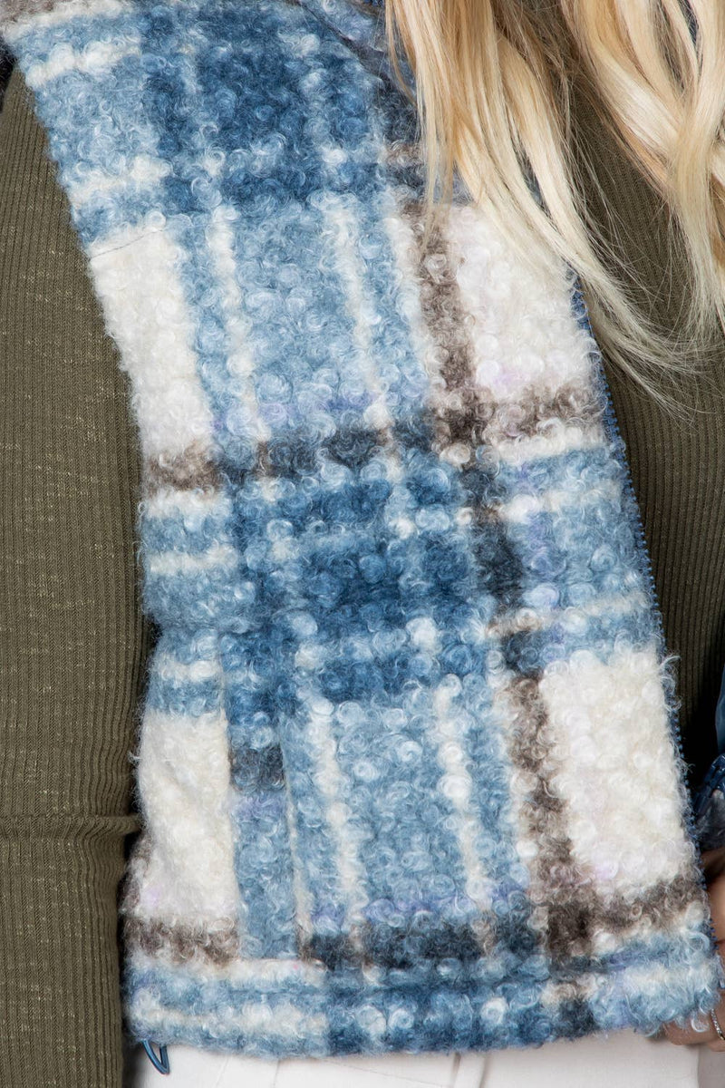 Curly sherpa crop puffer vest featuring a cozy blue plaid pattern, perfect for layering in stylish Long Island boutique fashion.