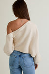 Soft cream asymmetrical shoulder sweater top with a relaxed fit and cozy knit, perfect for casual wear in a Long Island boutique fashion style.