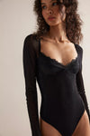 Black lace-trimmed bodysuit with sheer long sleeves and a fitted silhouette, perfect for chic styling from a Long Island boutique fashion.
