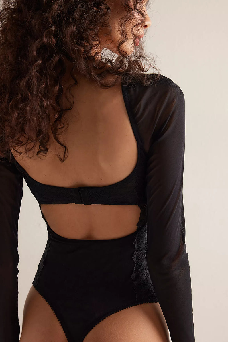 Black long-sleeve bodysuit featuring a delicate lace back and a form-fitting silhouette, perfect for Long Island boutique fashion.
