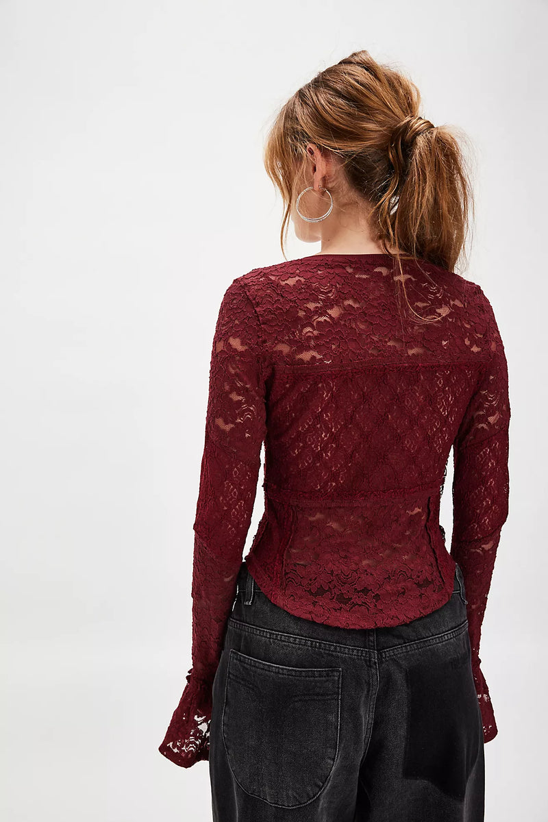 Lace long sleeve top in rich burgundy, featuring a fitted design and flared cuffs, perfect for chic layering in Long Island boutique fashion.