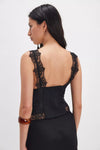 Black lace tank top featuring intricate detailing on the straps and a fitted bodice, perfect for a stylish look from a Long Island boutique fashion.