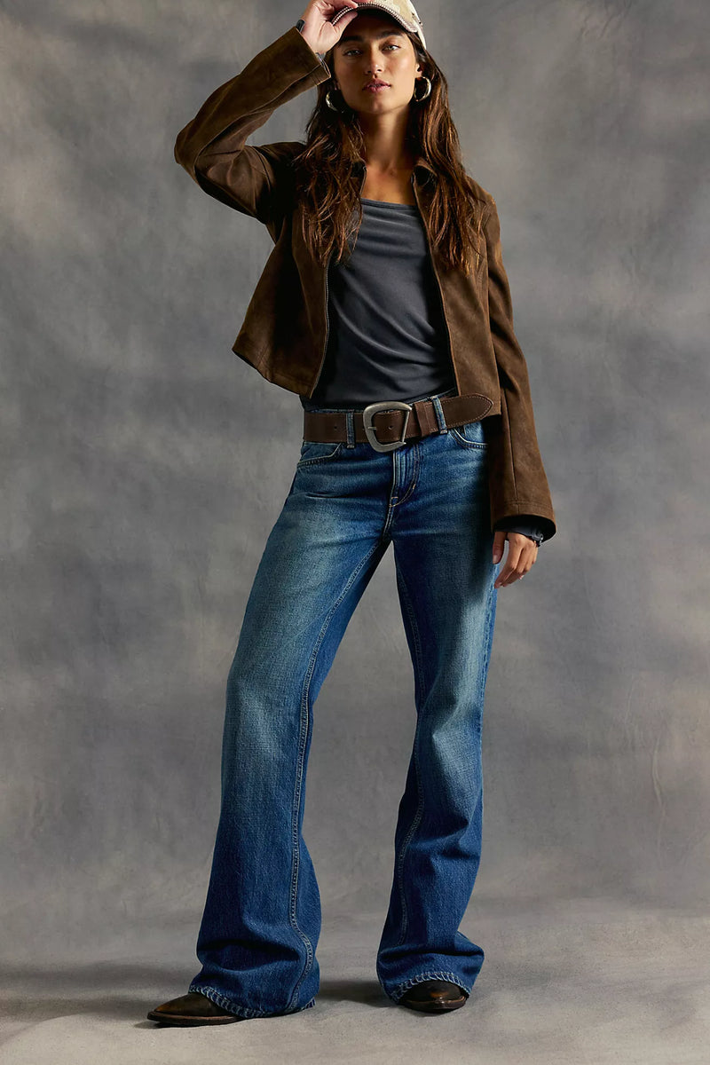 Relaxed fit blue jeans with a flared leg, showcasing a casual yet stylish vibe ideal for Long Island boutique fashion.