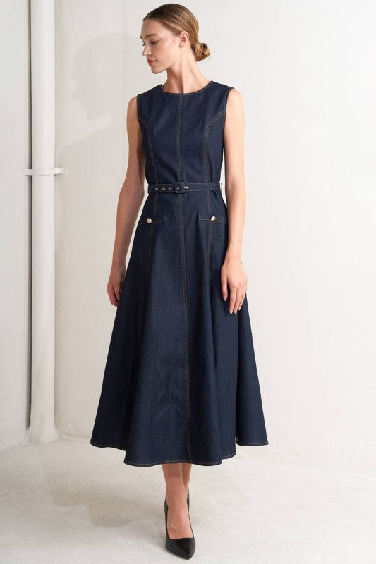 Sleek dark denim midi dress featuring a fitted bodice, belted waist, and flared skirt, showcasing Long Island boutique fashion.