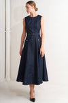 Sleeveless denim midi dress in dark blue with a fitted bodice, flared skirt, and belt, perfect for stylish Long Island boutique fashion.