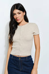 Chic beige ribbed button-up tee with a fitted silhouette and short sleeves, perfect for casual Long Island boutique fashion outings.
