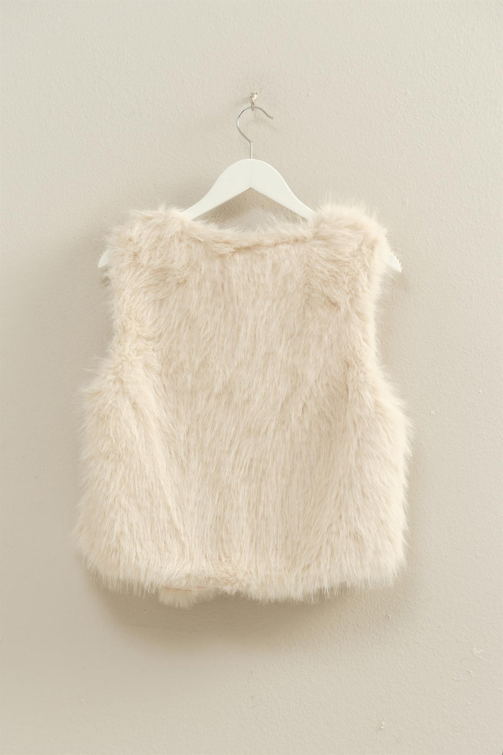 Luxuriously soft faux fur open vest in a creamy beige tone, perfect for layering in Long Island boutique fashion.