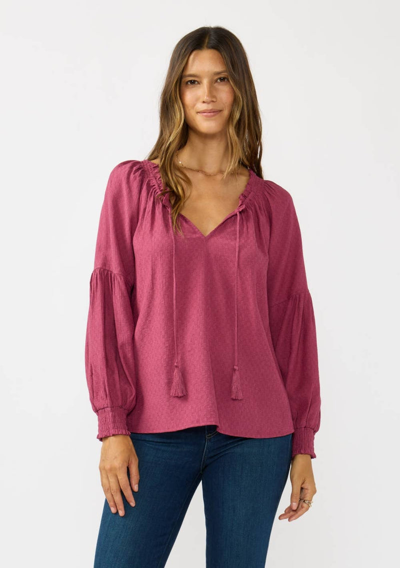Pink Bishop Raglan long sleeve boho top with tassel ties and a relaxed fit, perfect for casual days in Long Island boutique fashion.