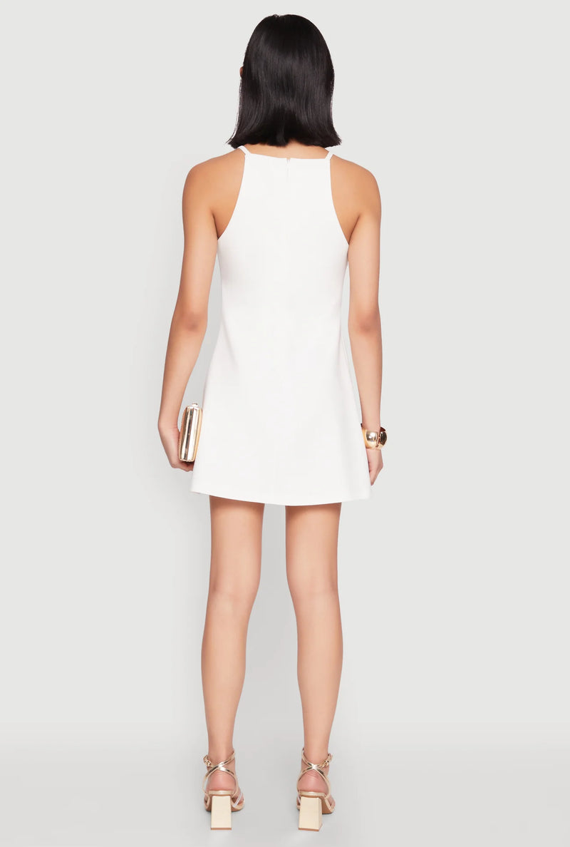 A sleeveless, white Bow Detail Dress featuring a flared fit and elegant back design, perfect for Long Island boutique fashion.