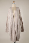 Oversized soft knit cardigan with batwing sleeves in a neutral tone, perfect for layering in Long Island boutique fashion.