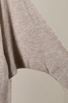 Soft knit oversized cardigan in a muted beige tone, featuring stylish batwing sleeves, perfect for Long Island boutique fashion.