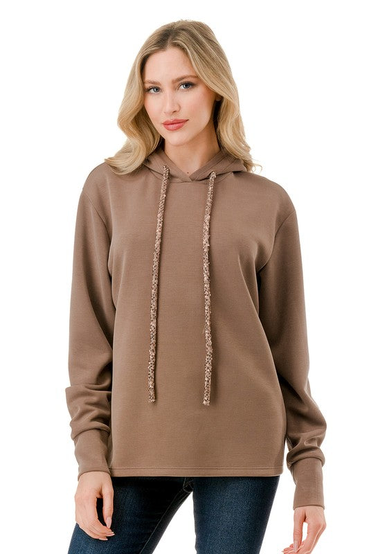 Cozy brown long sleeve hoodie with a relaxed fit and textured drawstrings, perfect for casual outings in Long Island boutique fashion.