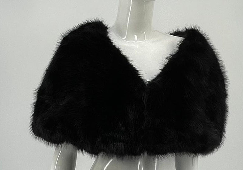 Soft black faux fur poncho featuring a chic open front design, perfect for layering in stylish Long Island boutique fashion.