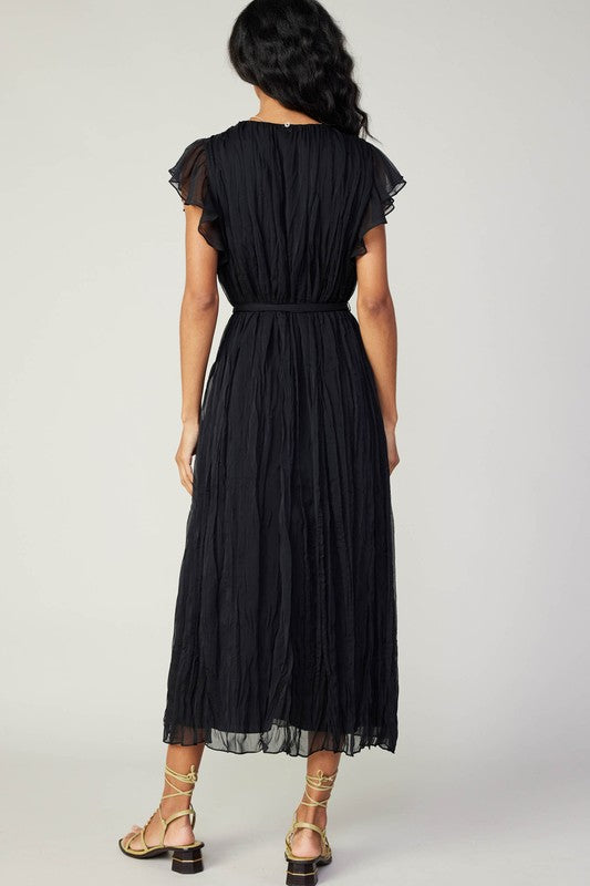 Flowing black Flutter Crinkle Dress featuring delicate ruffled sleeves and a cinched waist, perfect for Long Island boutique fashion.