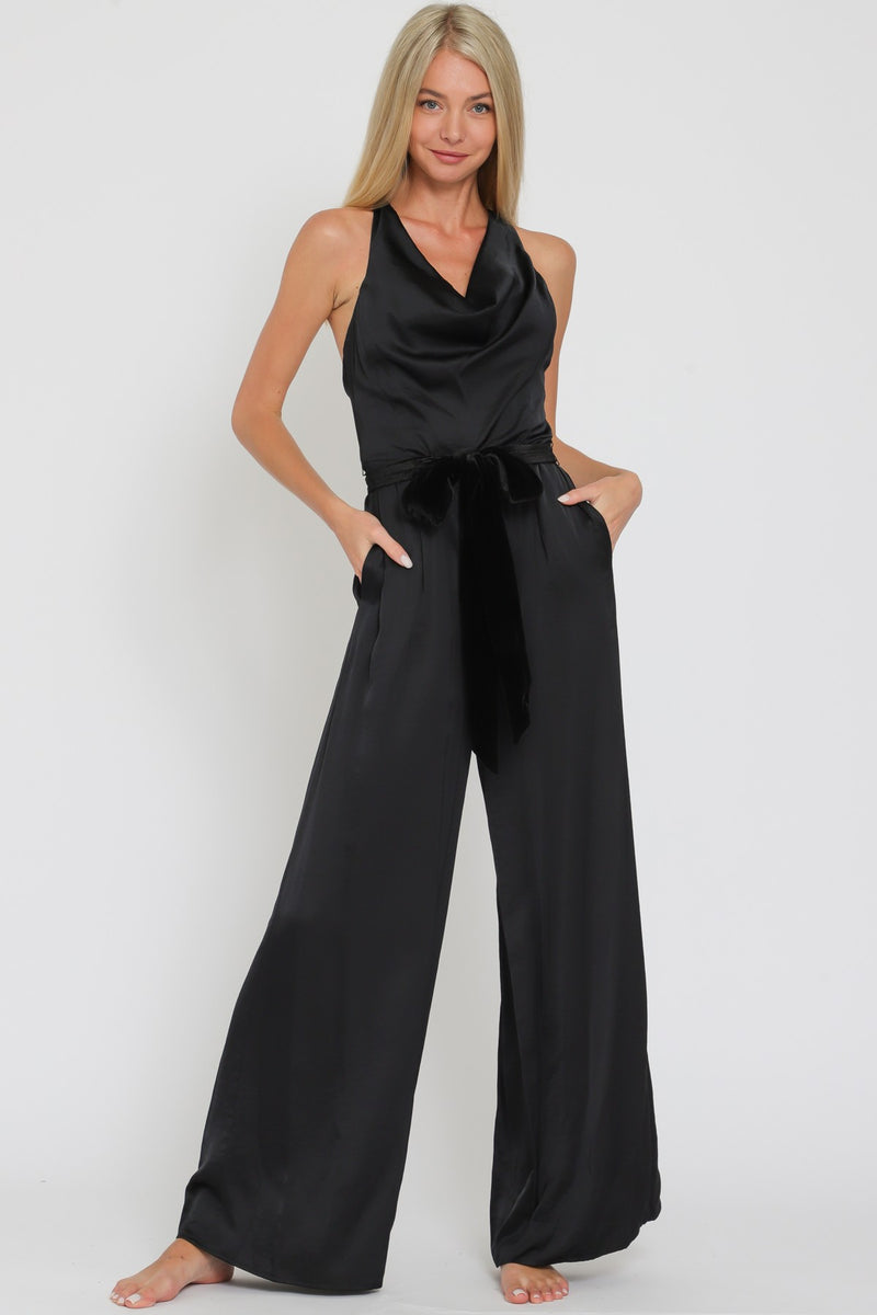 Sleek black cowl sleeveless jumpsuit with a belted waist and wide-leg fit, embodying elegance for Long Island boutique fashion.