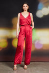 Dull satin elastic back trouser in rich red featuring a relaxed fit, high waist, and side pockets, perfect for Long Island boutique fashion.