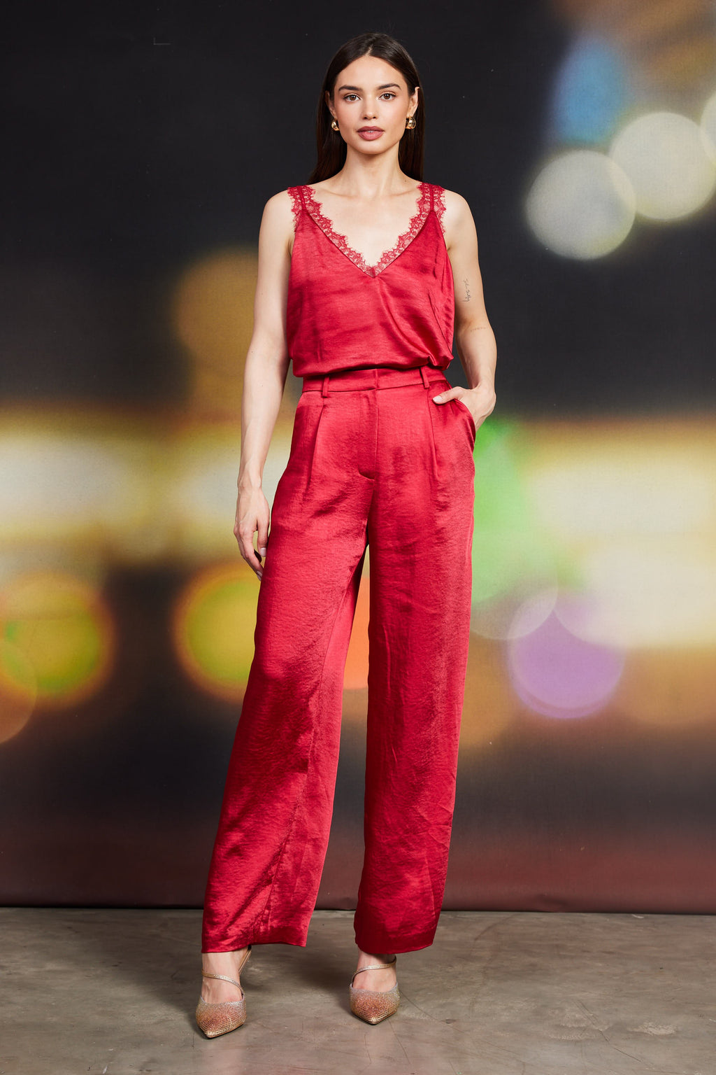 Dull satin elastic back trouser in rich red featuring a relaxed fit, high waist, and side pockets, perfect for Long Island boutique fashion.