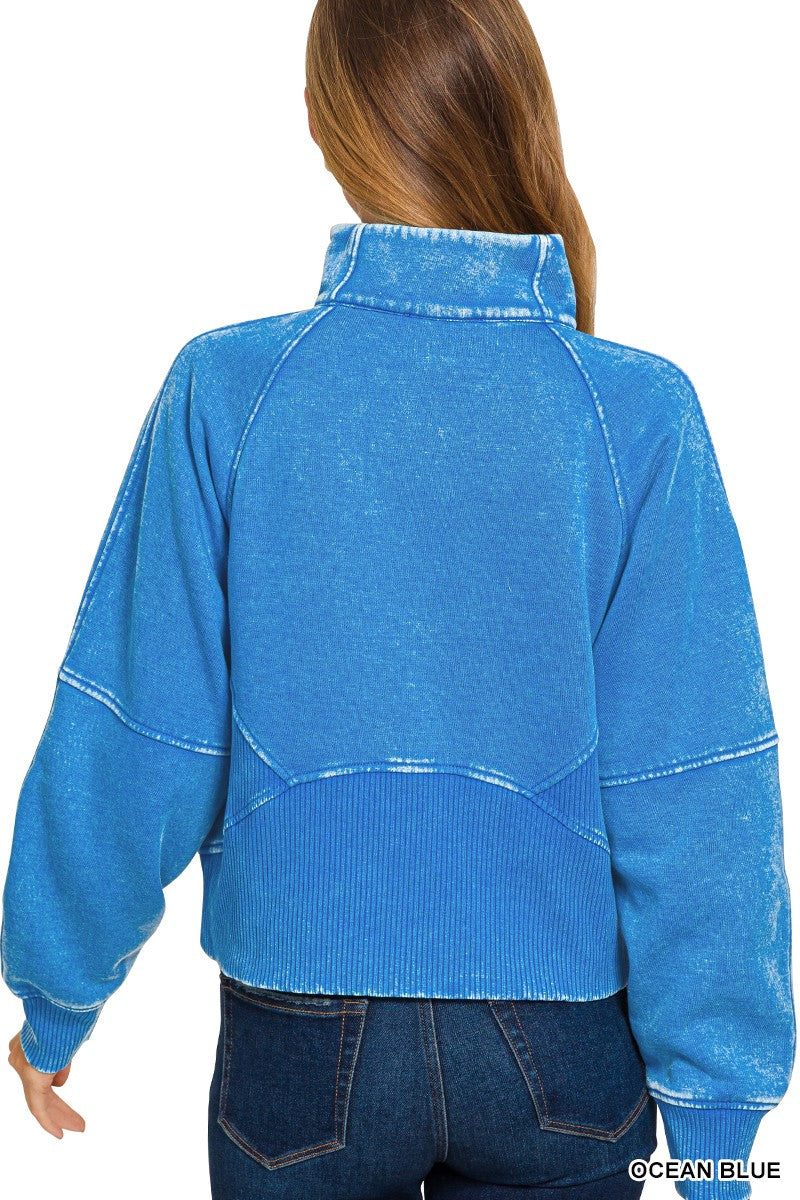 Acid washed blue half zip fleece pullover features a kangaroo pocket and relaxed fit, perfect for cozy Long Island boutique fashion.