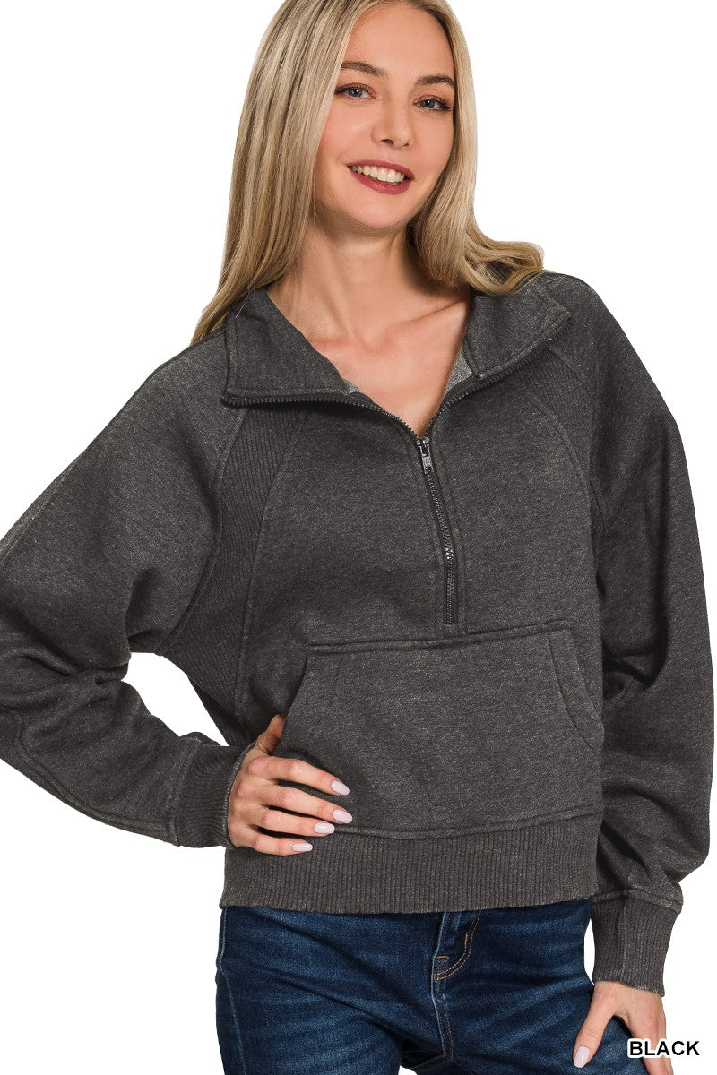 Soft black acid-washed half-zip fleece pullover featuring a kangaroo pocket and relaxed fit, perfect for cozy Long Island boutique fashion.