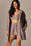 Soft, light gray fleece three-piece cardigan pajama set featuring a cozy cardigan, cropped top, and matching shorts, perfect for Long Island boutique fashion.
