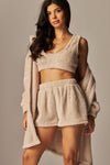 Cozy fleece 3-piece cardigan pajama set features a soft beige cropped top, matching shorts, and an oversized cardigan, perfect for Long Island boutique fashion.