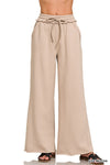 Soft ash mocha fleece wide leg sweatpants with exposed seams and adjustable drawstring, perfect for relaxed Long Island boutique fashion.