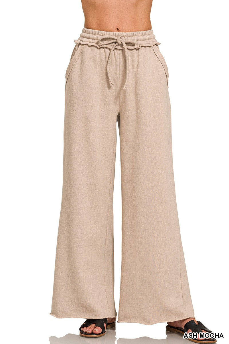 Soft ash mocha fleece wide leg sweatpants with exposed seams and adjustable drawstring, perfect for relaxed Long Island boutique fashion.