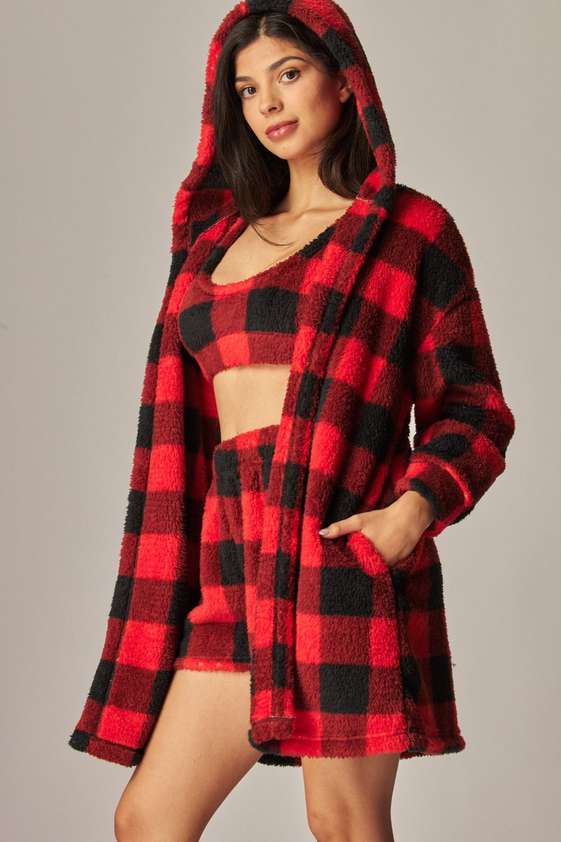 Cozy fleece three-piece pajama set featuring a red and black checkered cardigan, bralette, and shorts, ideal for Long Island boutique fashion.