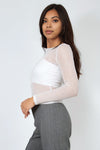 Fitted foil mesh crop top in sheer white with long sleeves, perfect for stylish layering in Long Island boutique fashion.