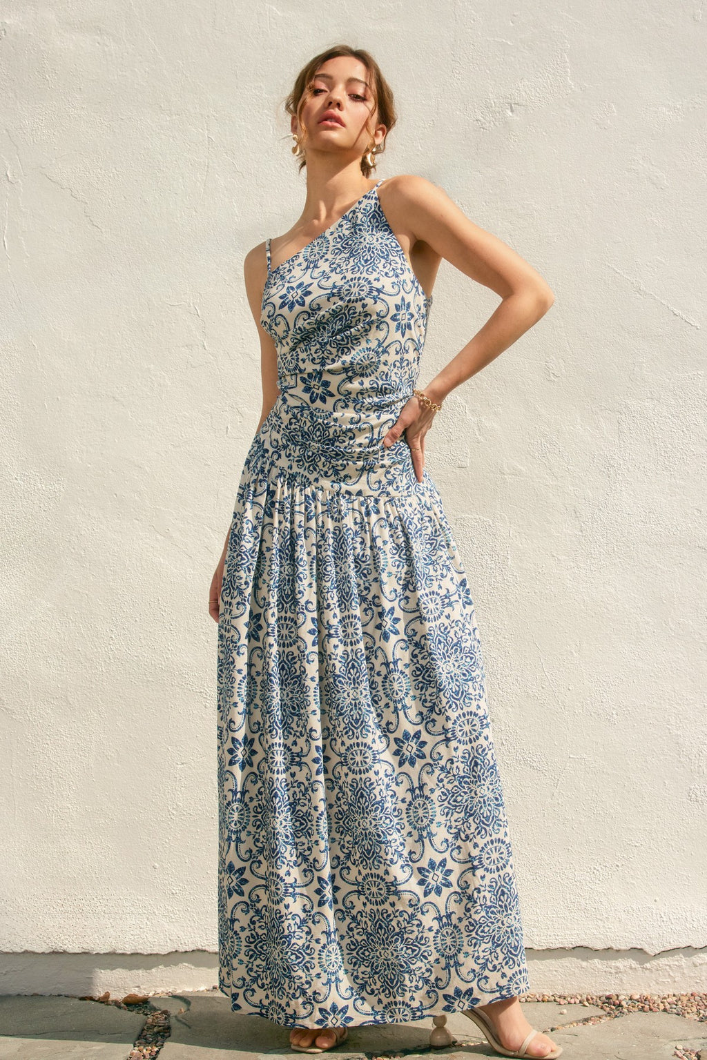 One-shoulder Azalea Mosaic Dress featuring a flowing, maxi silhouette in cream with intricate blue floral patterns, perfect for Long Island boutique fashion.