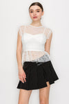 Double layered lace top featuring a corset-style design, sheer lace overlay, and a fitted white base, perfect for Long Island boutique fashion.