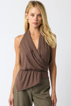 Brown halter top with a wrap design and elasticated hem, perfect for a chic look from a Long Island women’s boutique.