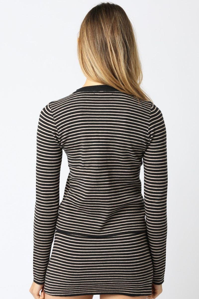 Long-sleeve knit top featuring a slim fit with black and beige horizontal stripes, ideal for stylish layering in Long Island boutique fashion.
