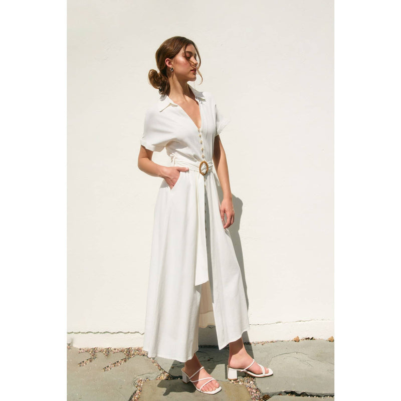 Elegant white maxi dress with a button-down front, short sleeves, and a stylish wicker buckle belt, perfect for Long Island boutique fashion.