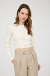 Cream button down long sleeve rib knit cardigan with a cropped fit, paired with high-waisted beige trousers, perfect for Long Island boutique fashion.