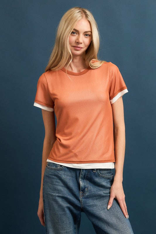 Front view of model wearing rust mesh overlay short sleeve tee