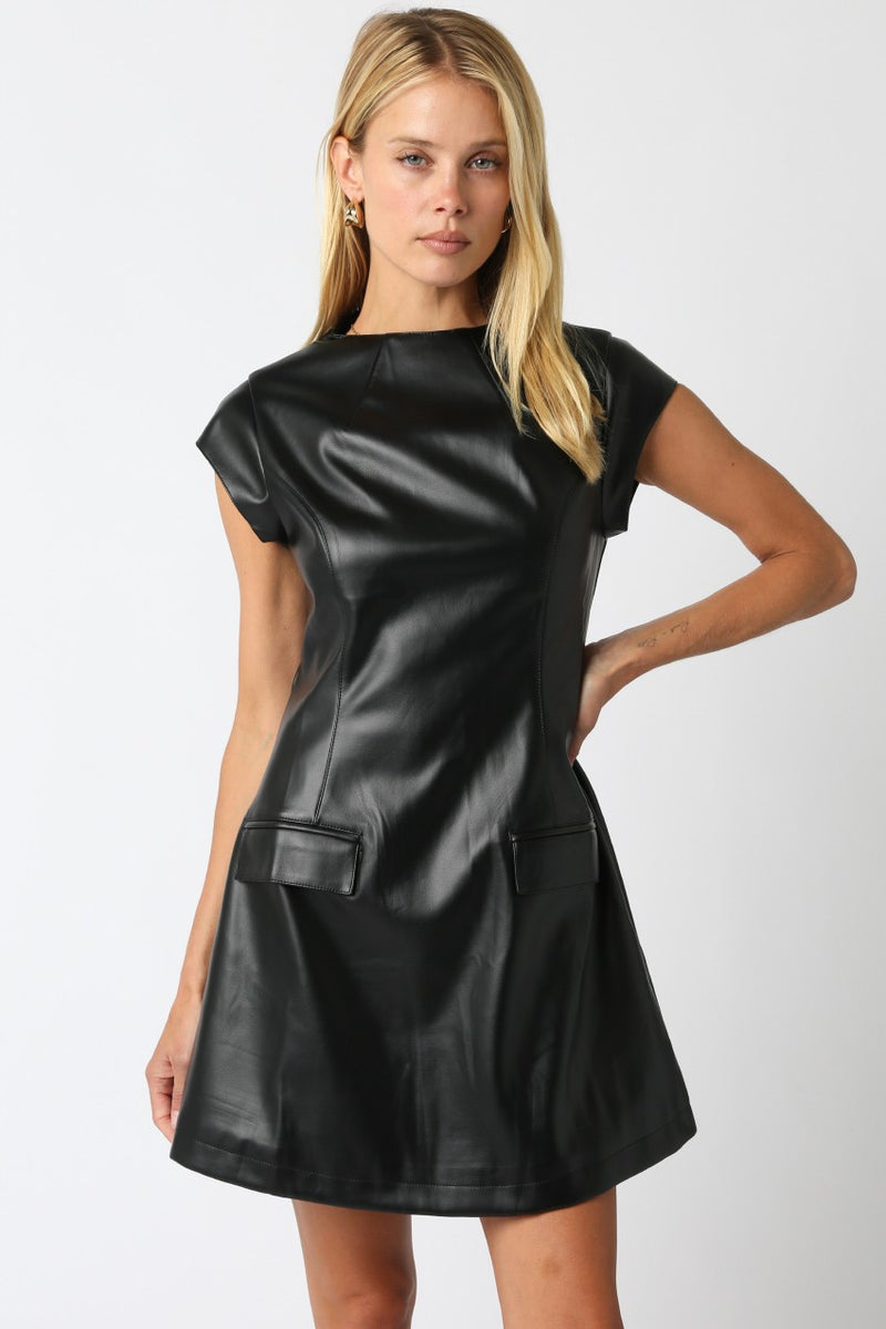 Sleek black pu dress featuring a fitted bodice, cap sleeves, and pocket details, perfect for Long Island boutique fashion enthusiasts.