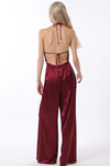 Backless cowl neck jumpsuit in rich burgundy satin, featuring wide-leg pants and adjustable ties, perfect for Long Island boutique fashion.