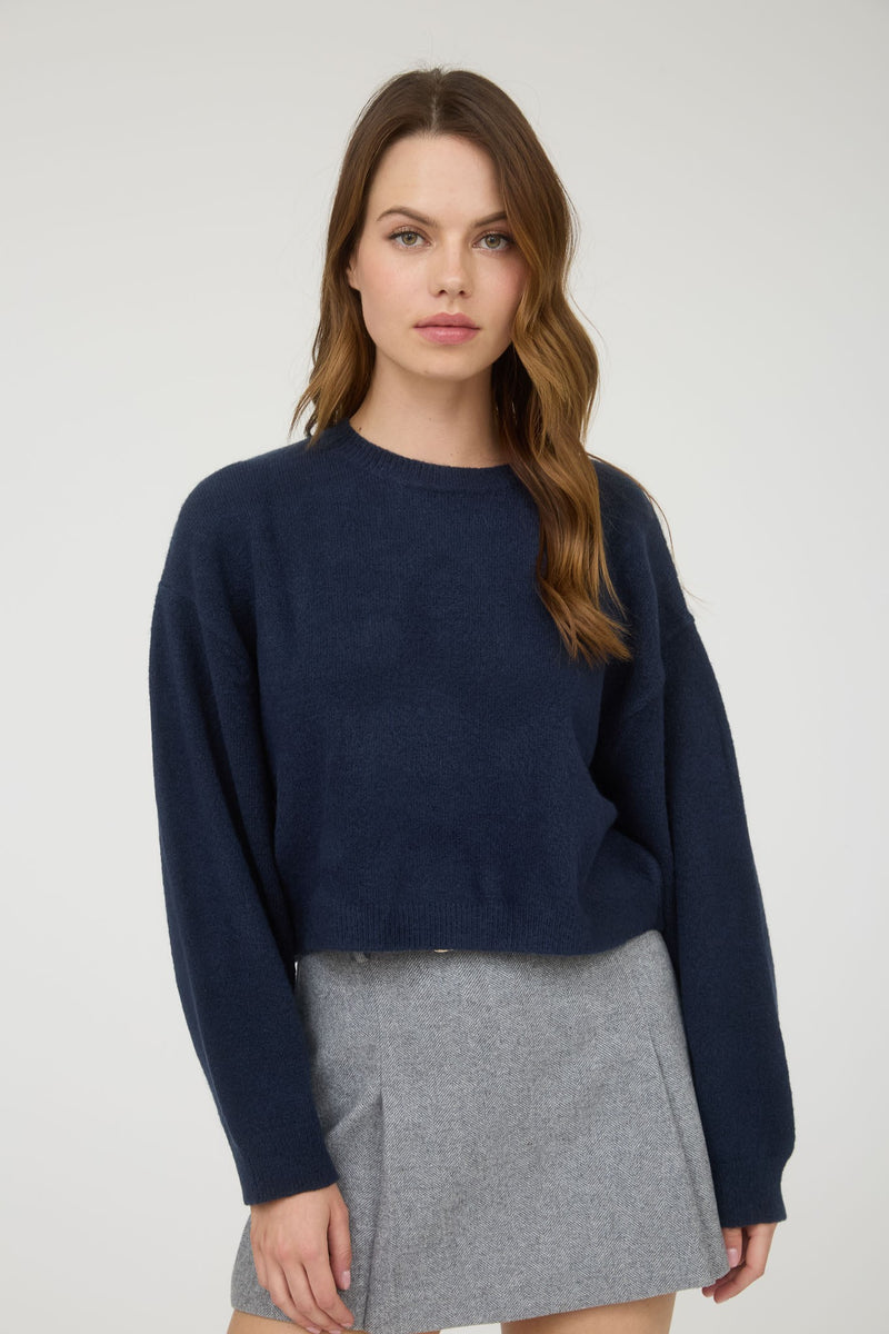 Navy crew neck long sleeve cropped pullover sweater featuring a relaxed fit, perfect for layering in Long Island boutique fashion.