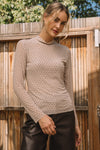 Sheer beige embellished mock neck top with long sleeves, perfect for layering in Long Island boutique fashion.