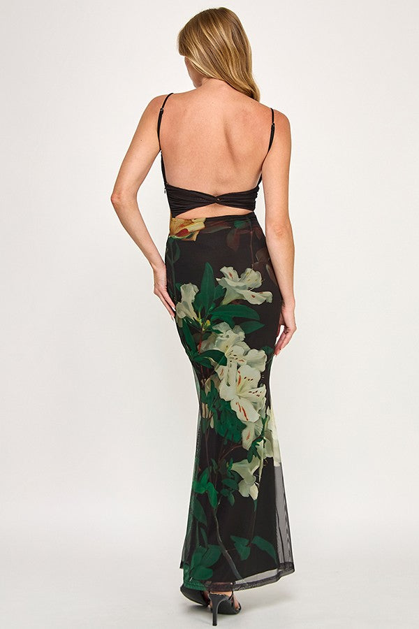 Elegant fitted floral slip dress with a black background, featuring vibrant white and green flowers, perfect for Long Island boutique fashion.