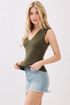 Sleeveless deep olive top featuring a double layer design and wide shoulders, perfect for a chic Long Island boutique fashion look.