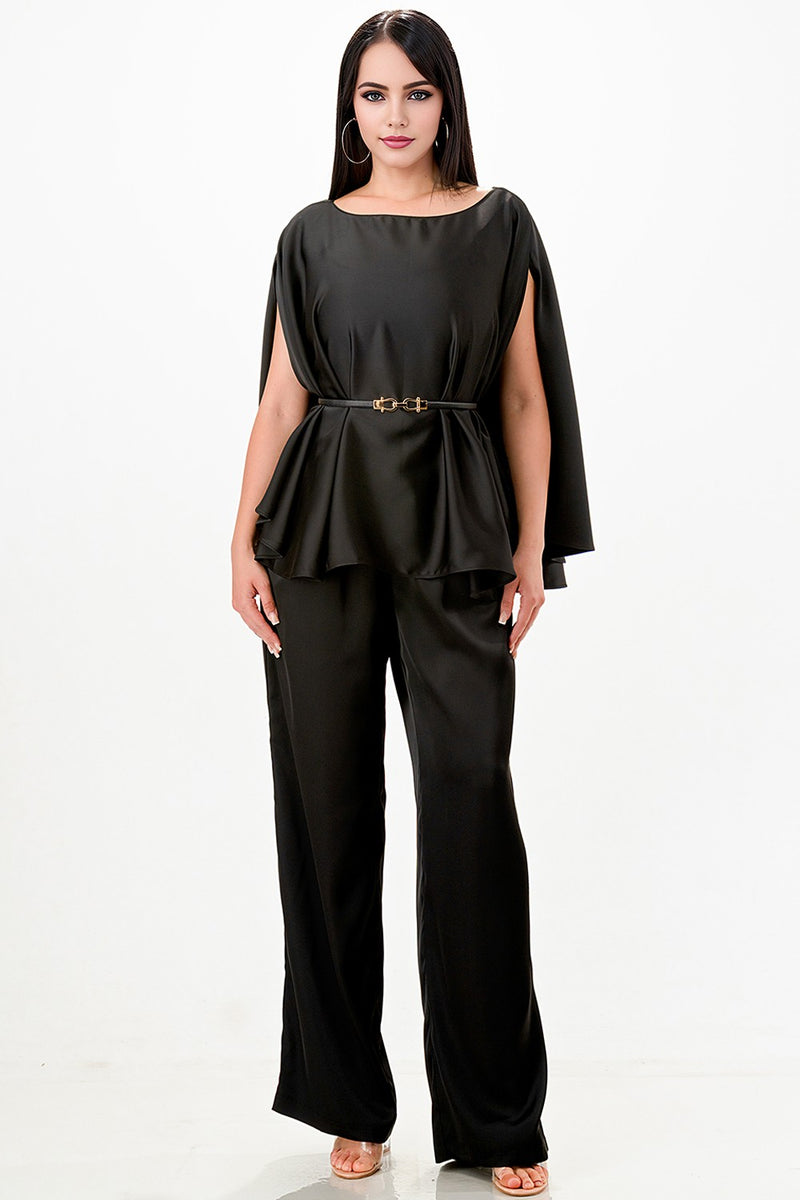 Stylish black draped cape top paired with wide-leg pants features elegant detailing, perfect for Long Island boutique fashion.