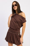 Asymmetrical brown bubble dress featuring a drapey fit and a stylish grommet belt, perfect for Long Island boutique fashion.