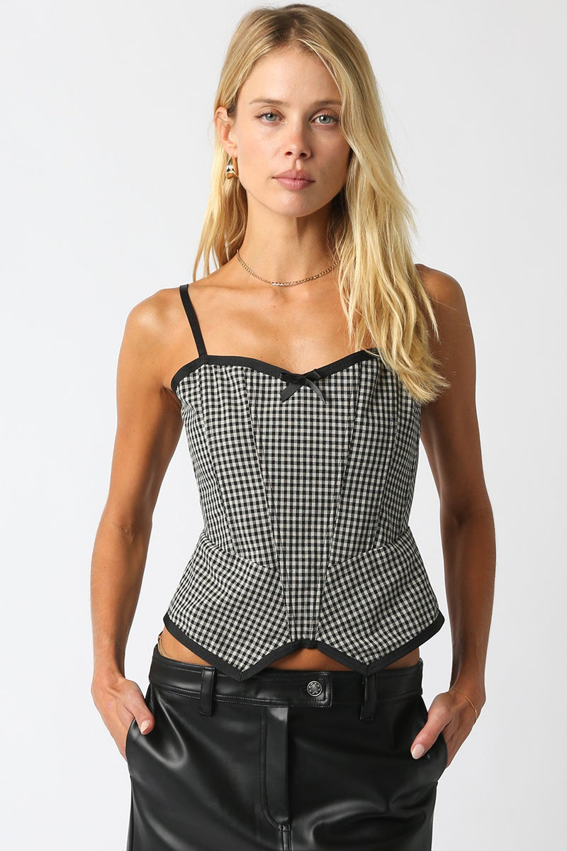 Black and white gingham top with a fitted design, adjustable straps, and a decorative bow, ideal for stylish Long Island boutique fashion.