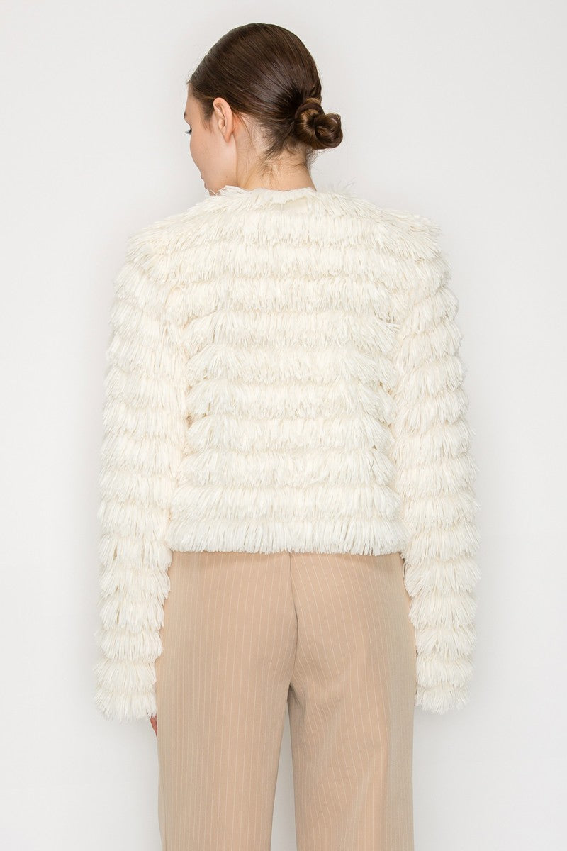 Cream faux fur shaggy jacket featuring a textured design and relaxed fit, perfect for elegant layering in Long Island boutique fashion.