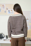 Cozy collared knit sweater featuring a geometric stripe pattern in rich brown and cream, perfect for Long Island boutique fashion.