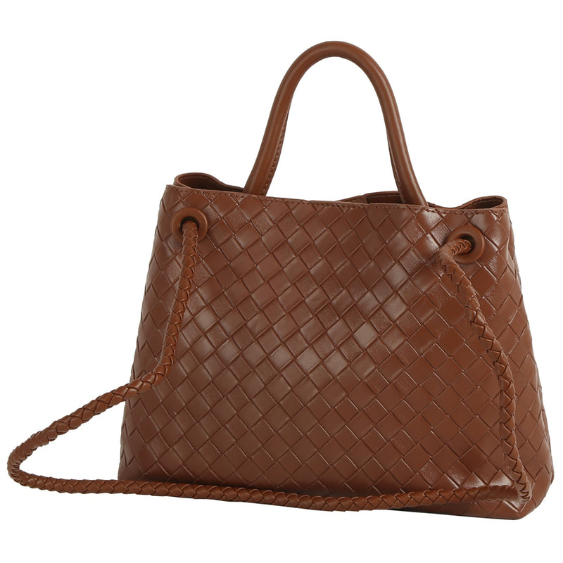 Stylish woven brown satchel with braided strap and structured shape, ideal for elevating any look from a Long Island fashion boutique.